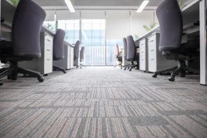 A close-up of the carpeting in an office space.
